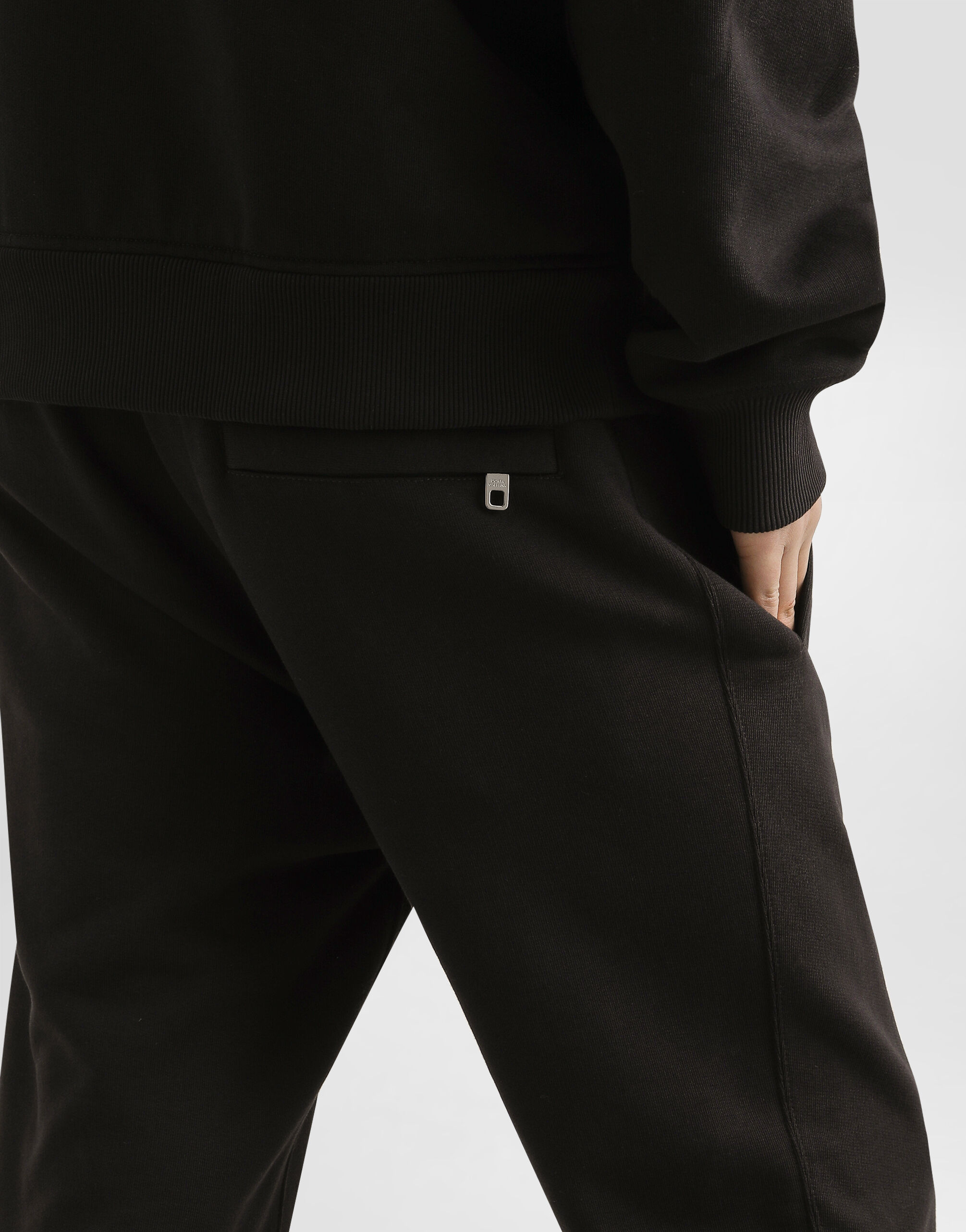 Jersey trousers with heraldic patch in Black for Men