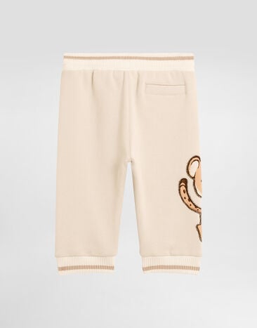Dolce & Gabbana Oversized fleece trousers with DG patch and leopard print Beige L1JPKVG7PJN