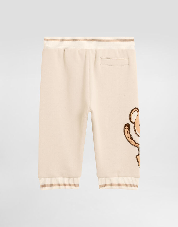 Dolce & Gabbana Oversized fleece trousers with DG patch and leopard print Beige L1JPKVG7PJN