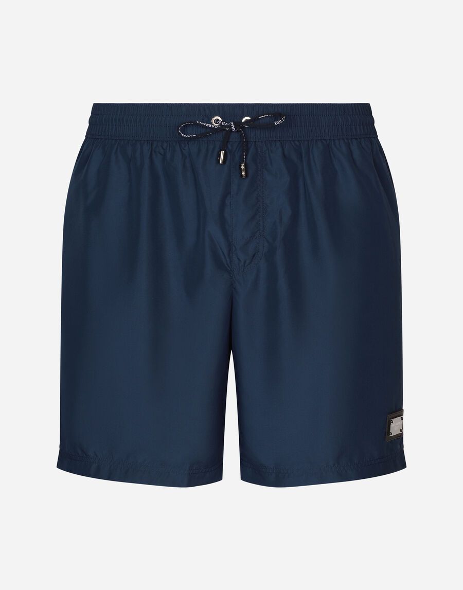 Long-leg swim trunks with branded tag