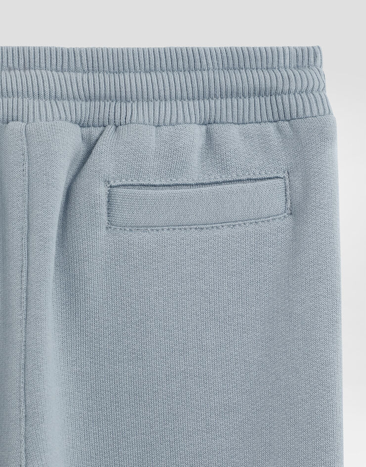 Dolce & Gabbana Oversized fleece trousers with leopard print and DG patch Blue L1JPIGG7PJD