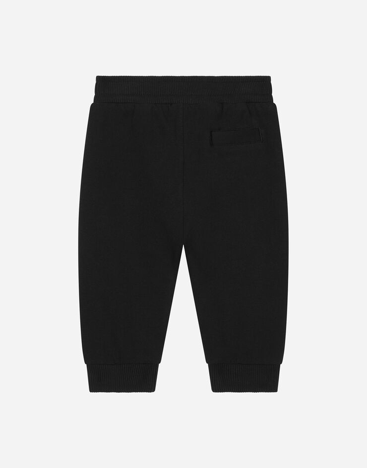 DolceGabbanaSpa Pantalon de jogging en jersey à imprimé logo Noir L1JPIGG7KU7
