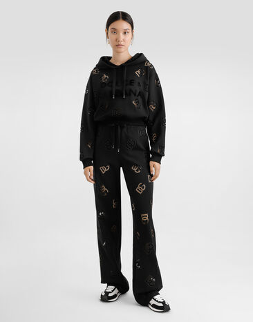 Dolce & Gabbana Pantalon de jogging en jersey avec broderie ajourée logo DG Black FTCYYZGDCTU
