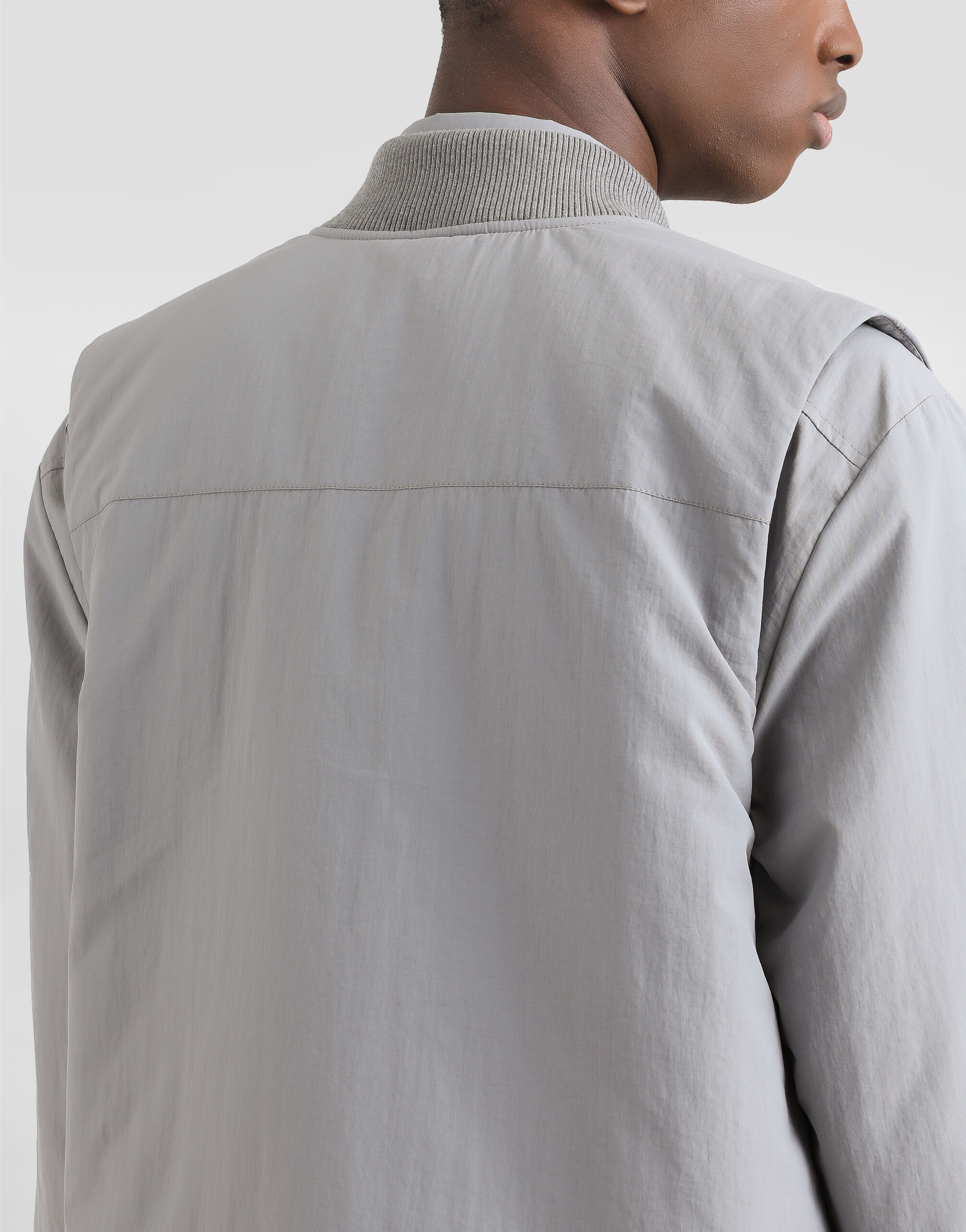 Padded technical fabric vest with tag in Grey for Men