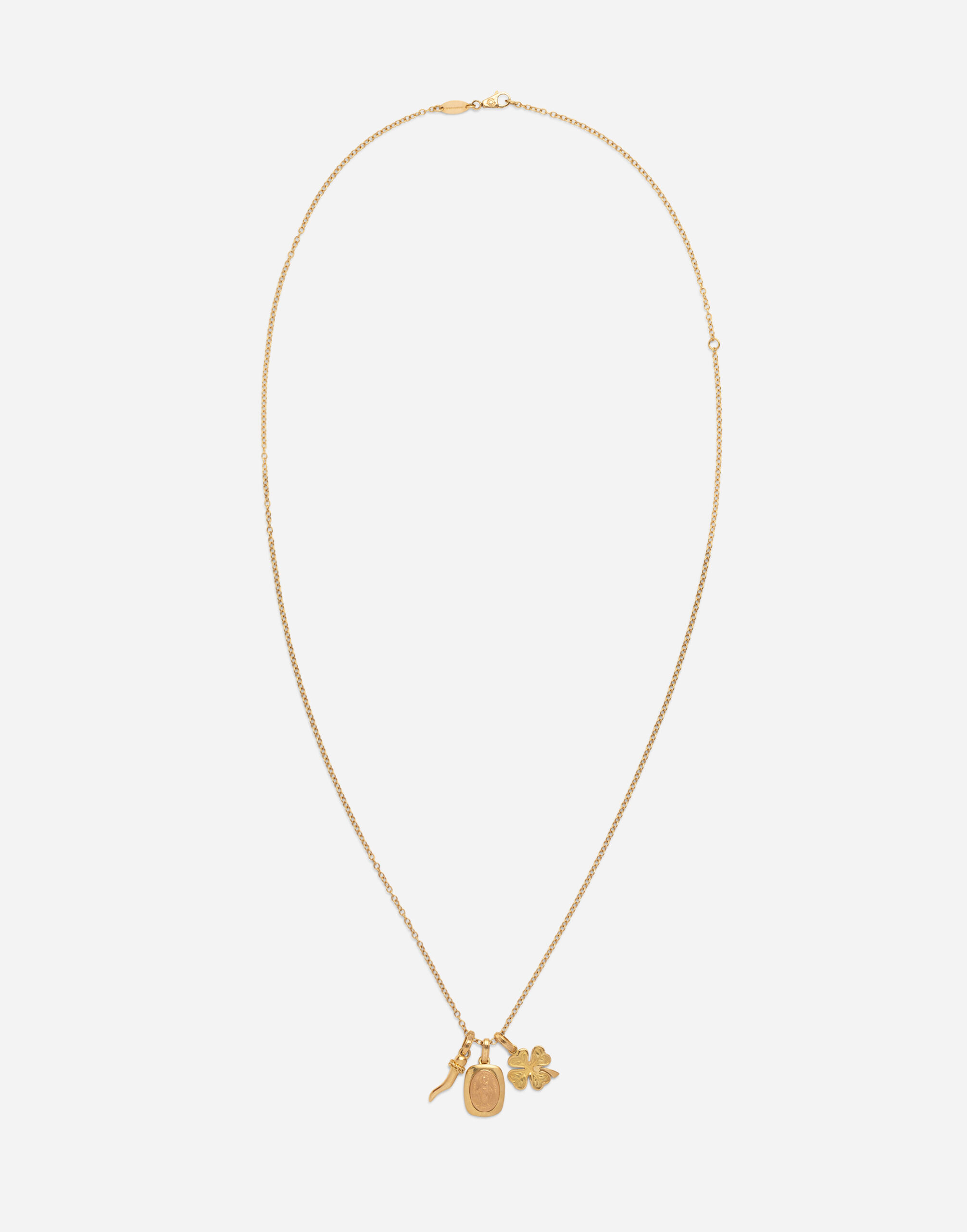 Devotion yellow and red gold rounded rectangular pendant with a red gold Virgin Mary medallion horn and four leaf clover pendants on yellow gold