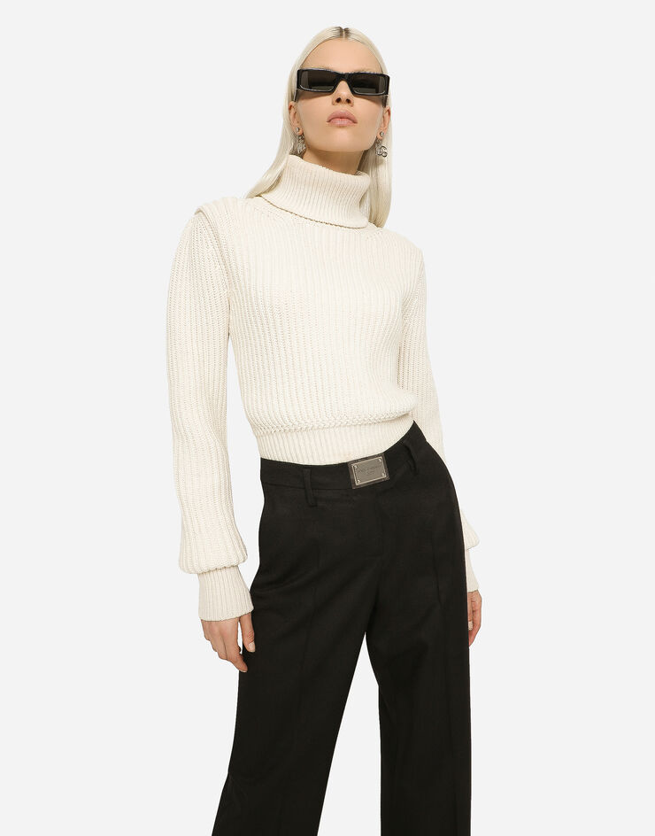 Dolce&Gabbana Pantalon flare en flanelle avec plaquette à logo Noir FTCZITGDBWV