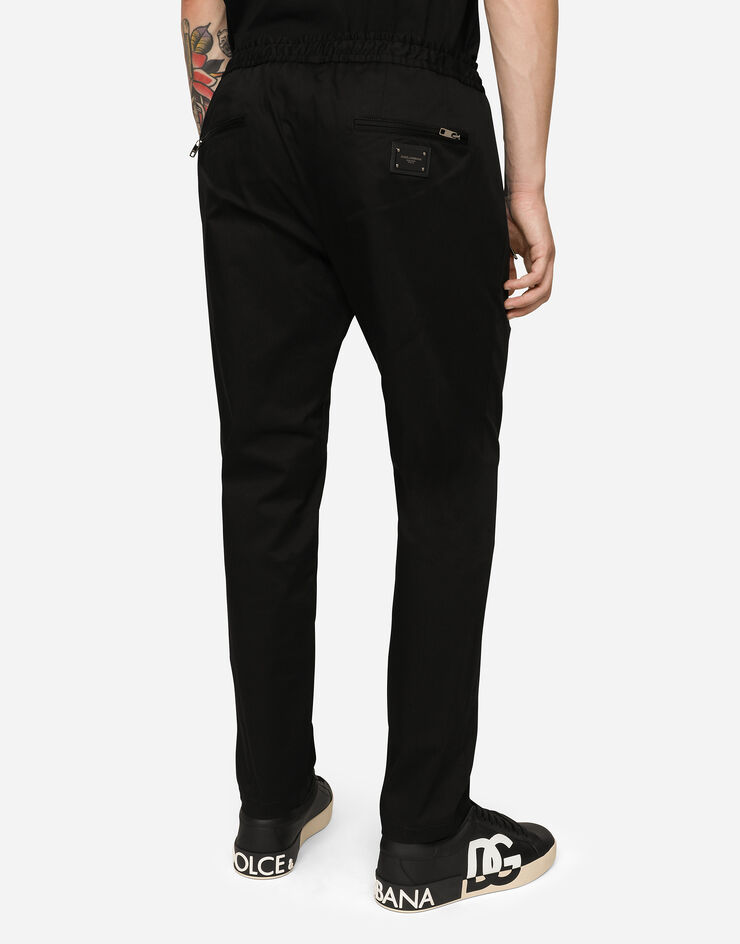 Dolce & Gabbana Pantalones de chándal de algodón elástico con placa Negro GYACETFUFIS