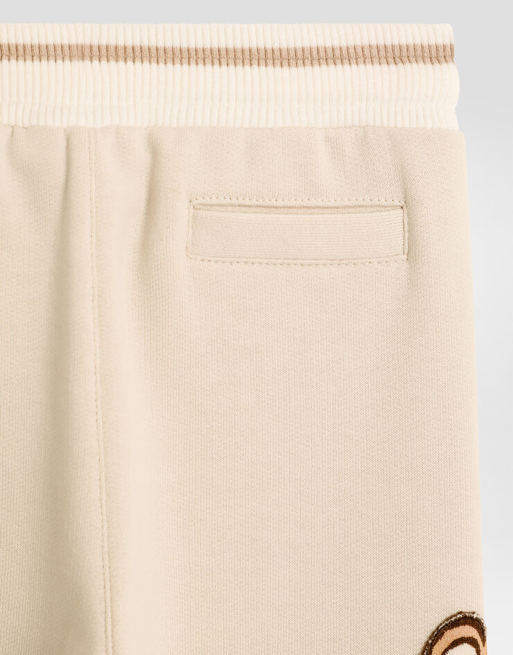 Dolce & Gabbana Oversized fleece trousers with DG patch and leopard print Beige L1JPKVG7PJN