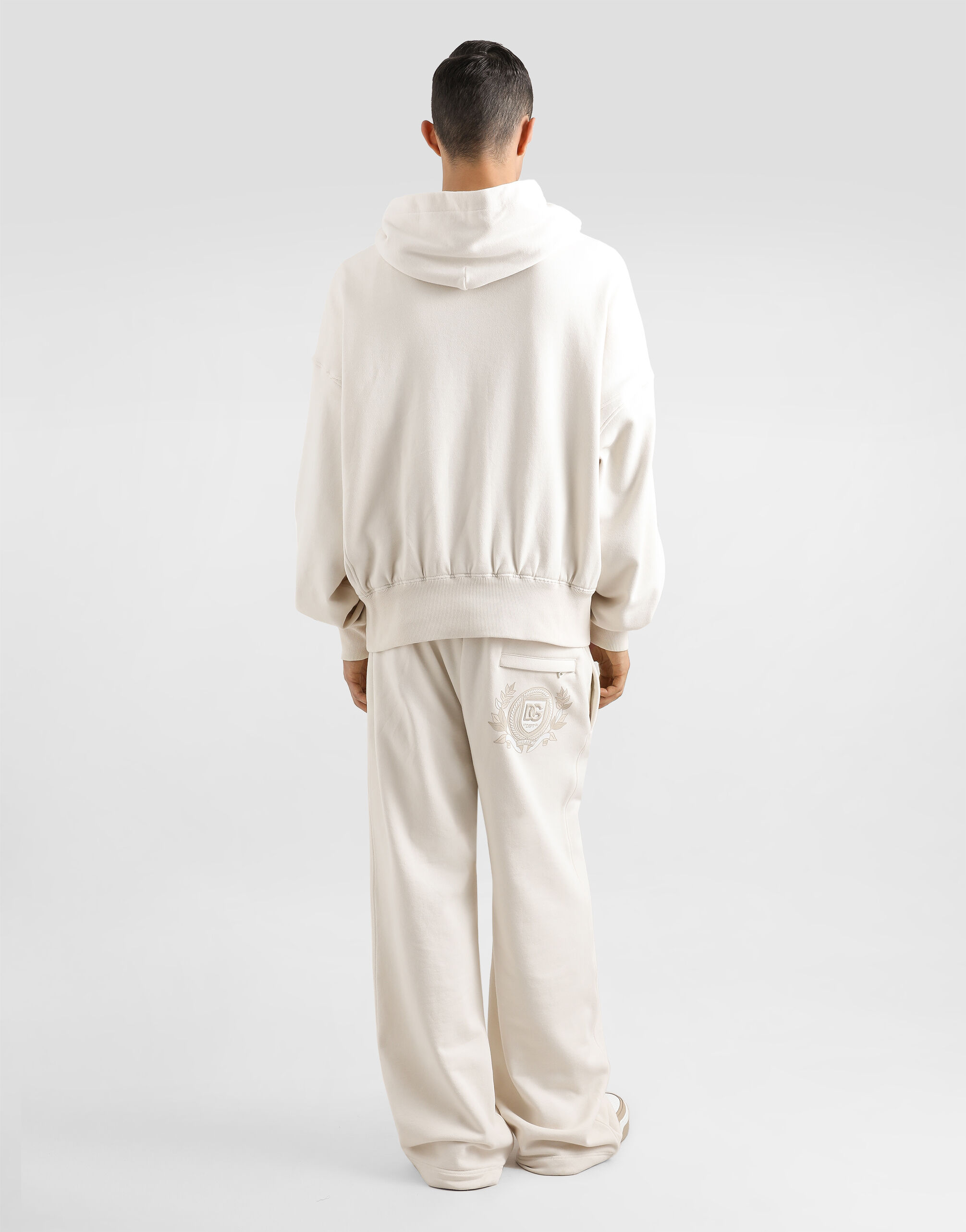Stretch jersey jogging pants with embroidery in Cream for Men