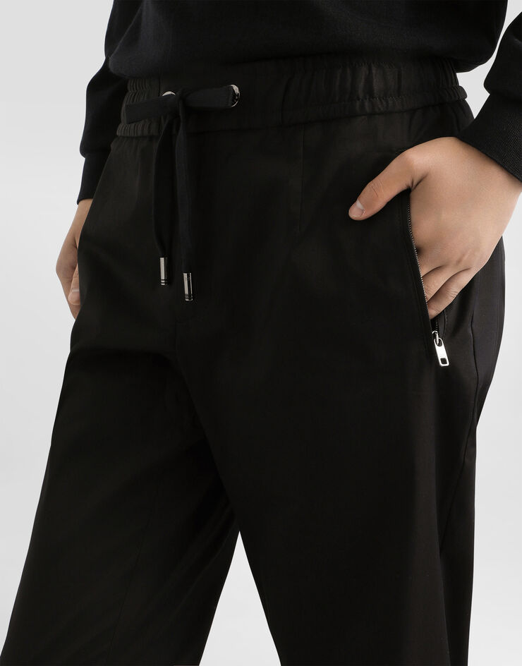 Dolce & Gabbana Jogginghose Baumwollstretch mit Plakette Schwarz GVZAETFUFJR