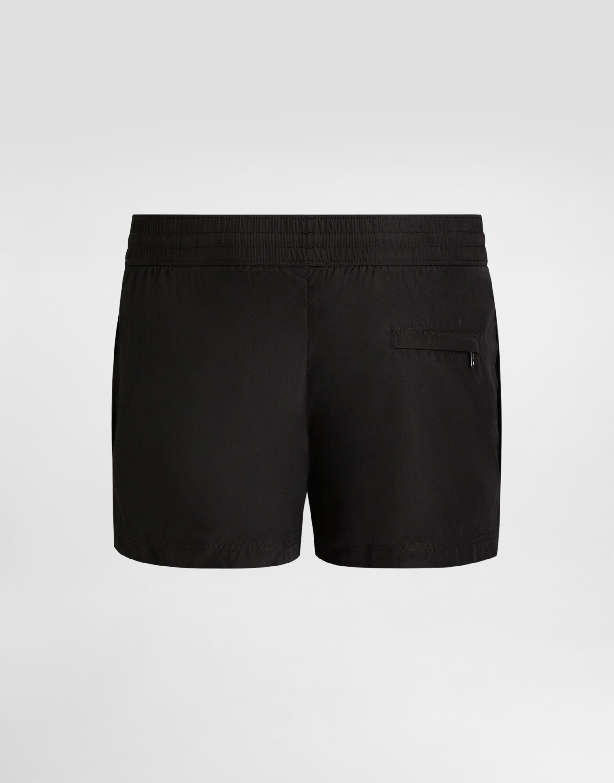 Short swim trunks with branded tag in Black for Men