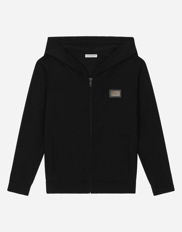 Dolce & Gabbana Cardigan zippé en maille jersey avec capuche et plaquette à logo Noir L4KWE1JCVR9