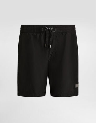Dolce & Gabbana Mid-length swim trunks with logo tag Black M4E45TON0DK