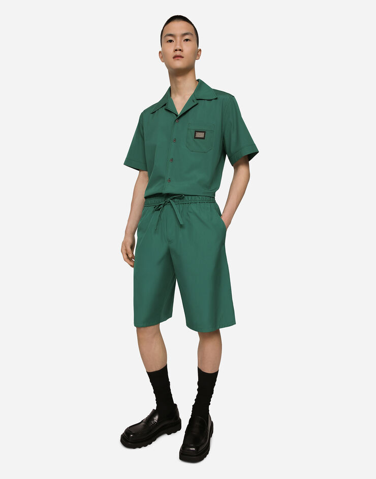 Dolce & Gabbana Jogging-Bermudashorts aus Baumwolle mit Logoplakette Mehrfarbig GV37ATGF855