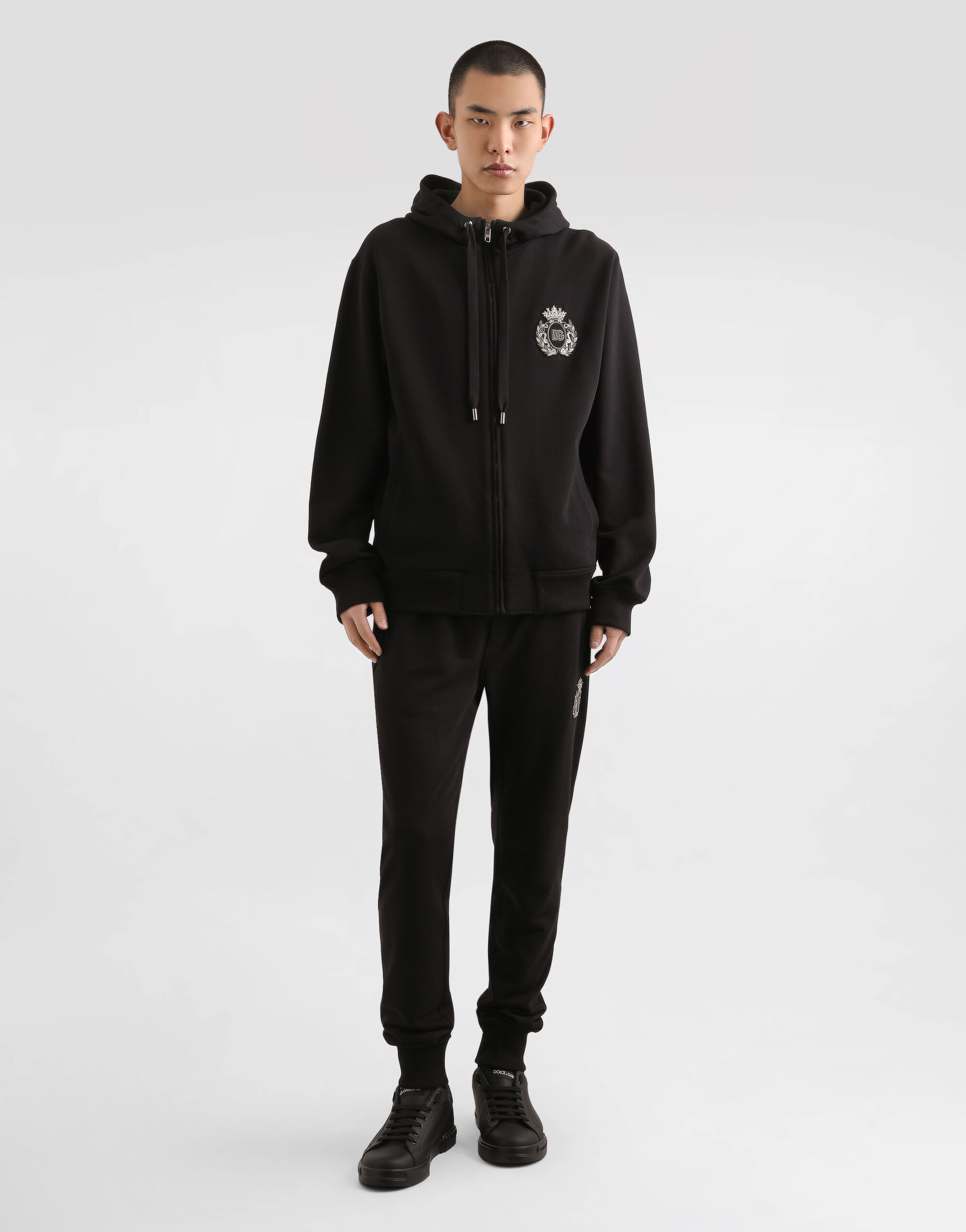 Jersey trousers with heraldic patch in Black for Men
