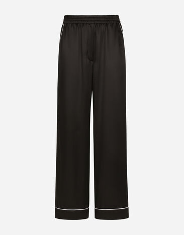 Dolce & Gabbana Pyjamahose aus Seide mit kontrastierender Paspelierung Schwarz FTAMPTFU1AU