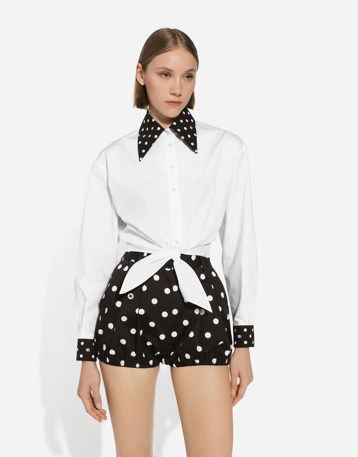 Dolce & Gabbana Camisa cropped con nudo en la cintura de algodón con estampado de lunares Blanco F5P61TGDCMO
