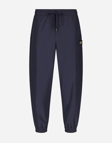 Dolce & Gabbana Pantalon de jogging en nylon avec plaquette à logo Gris BM7329AG218