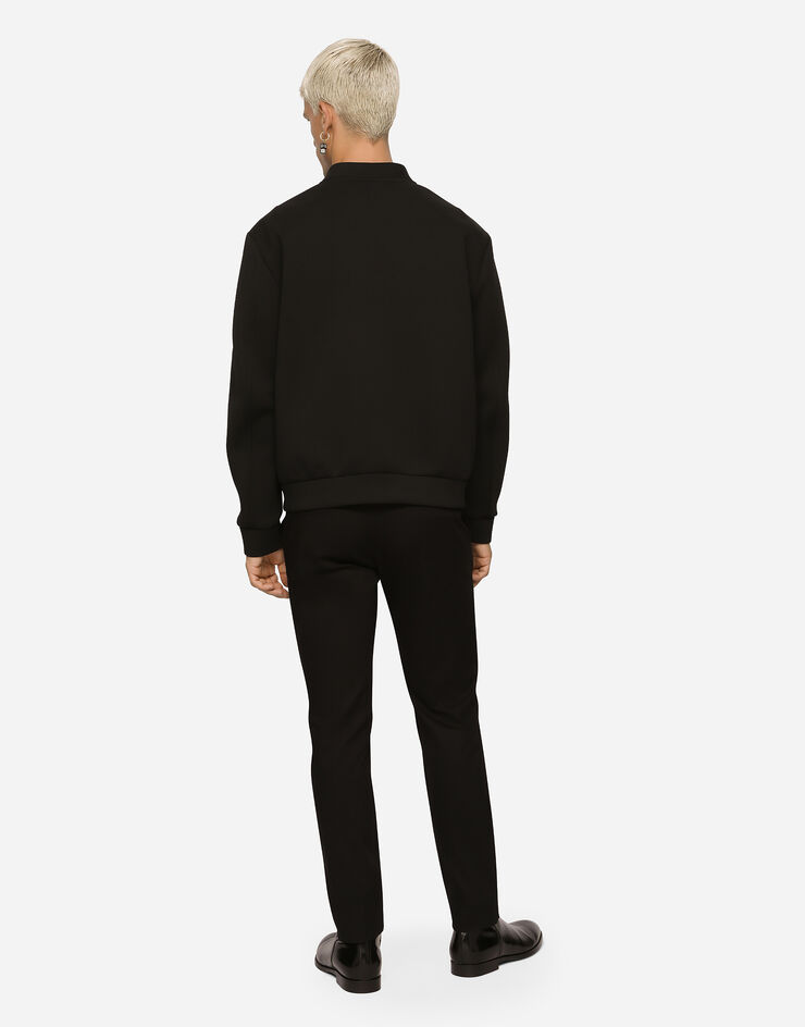 Dolce & Gabbana Technical piqué jacket with branded tag Black G9ABDTGF786