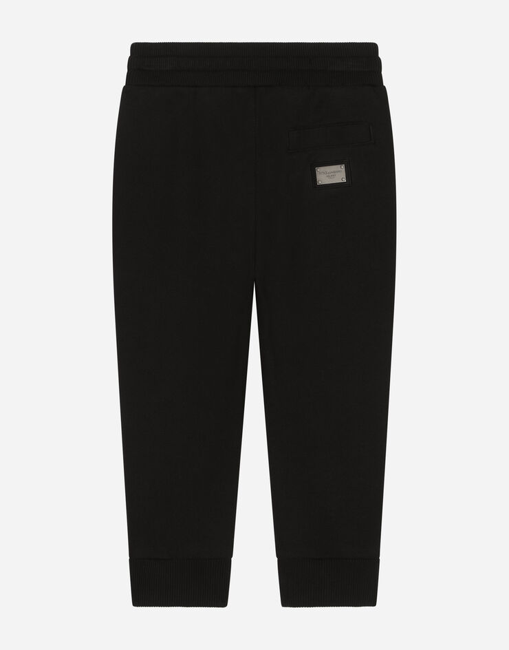 DolceGabbanaSpa Pantaloni jogging in jersey con placca logo Black L4JPT0G7I2P