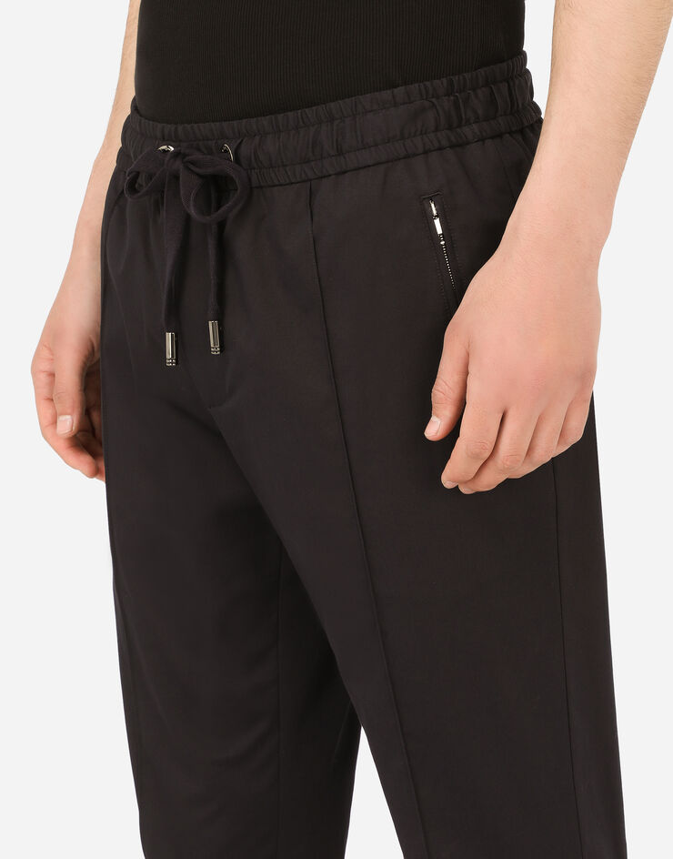 Dolce & Gabbana Stretch cotton jogging pants with plate Blue GYACETFUFJR