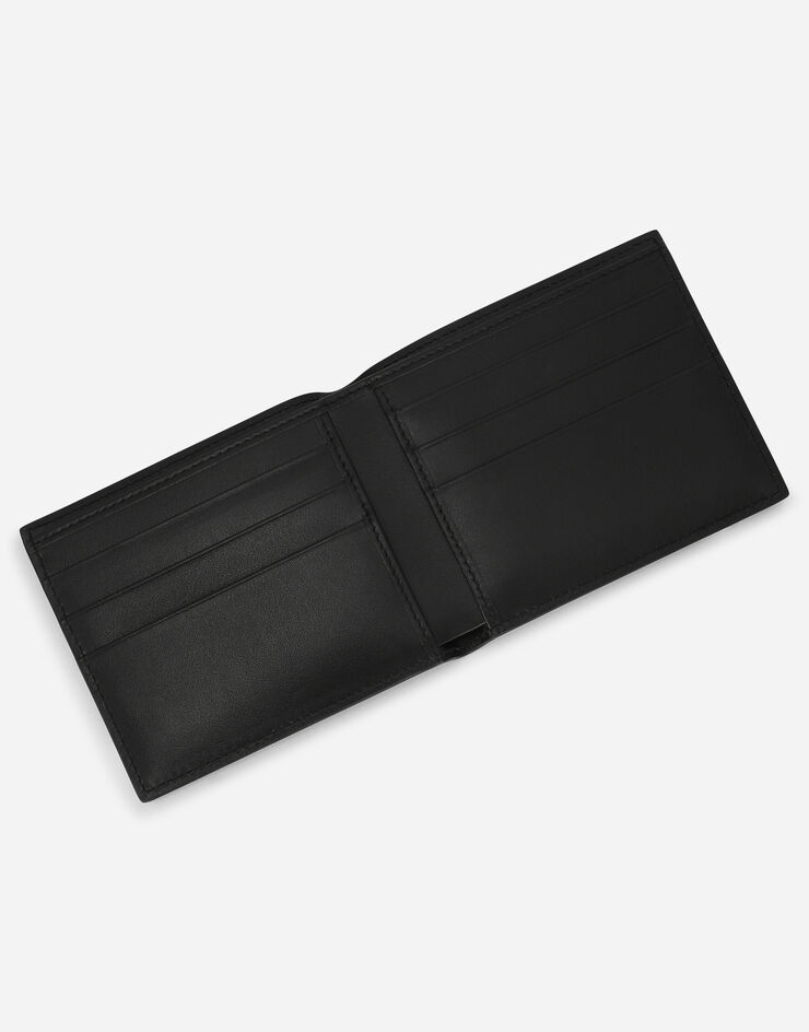 Dolce & Gabbana Portafoglio bifold in pelle di vitello con logo in rilievo Nero BP1321AG218