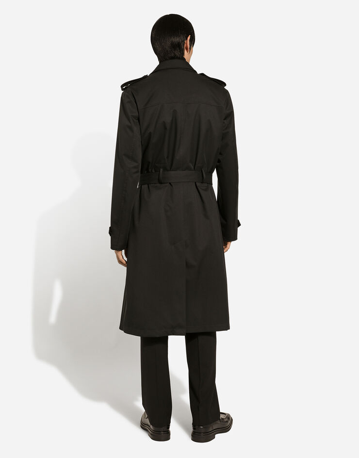 Dolce & Gabbana Zweireihiger Trenchcoat aus Nylon Schwarz G042RTFUS0D