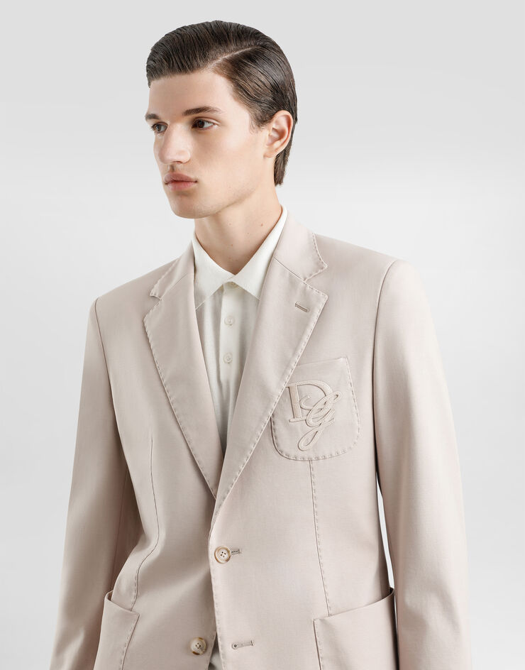 Dolce & Gabbana Einreihige Jacke aus Stretchjersey mit Logostickerei Beige G2TJ6ZFUGS1