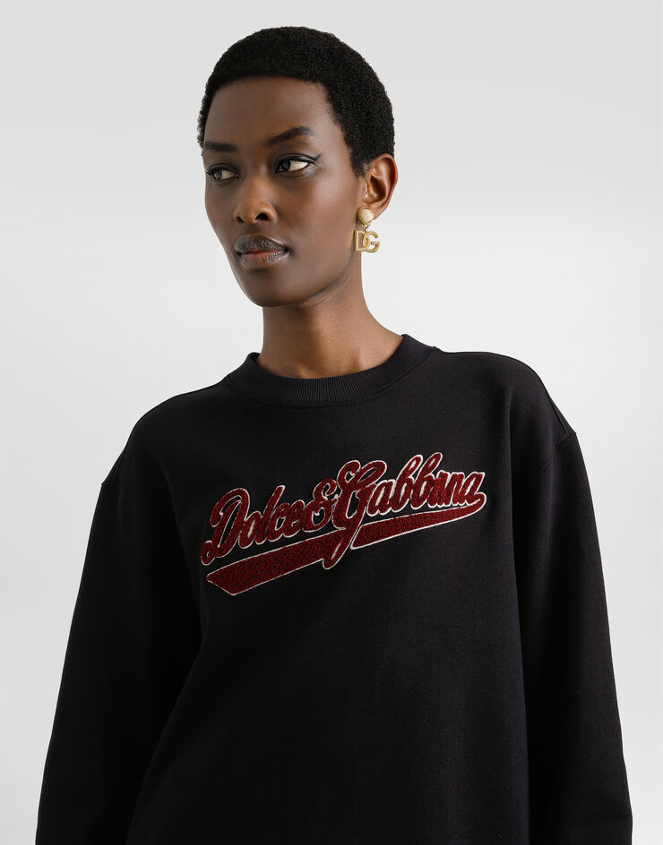 Dolce & Gabbana Rundhalssweatshirt aus Baumwolle mit Patch Schwarz F9S50ZGDDAI