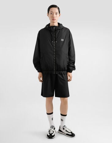 Dolce & Gabbana Cazadora de tejido técnico con capucha y placa Negro G9BGSTFUS22