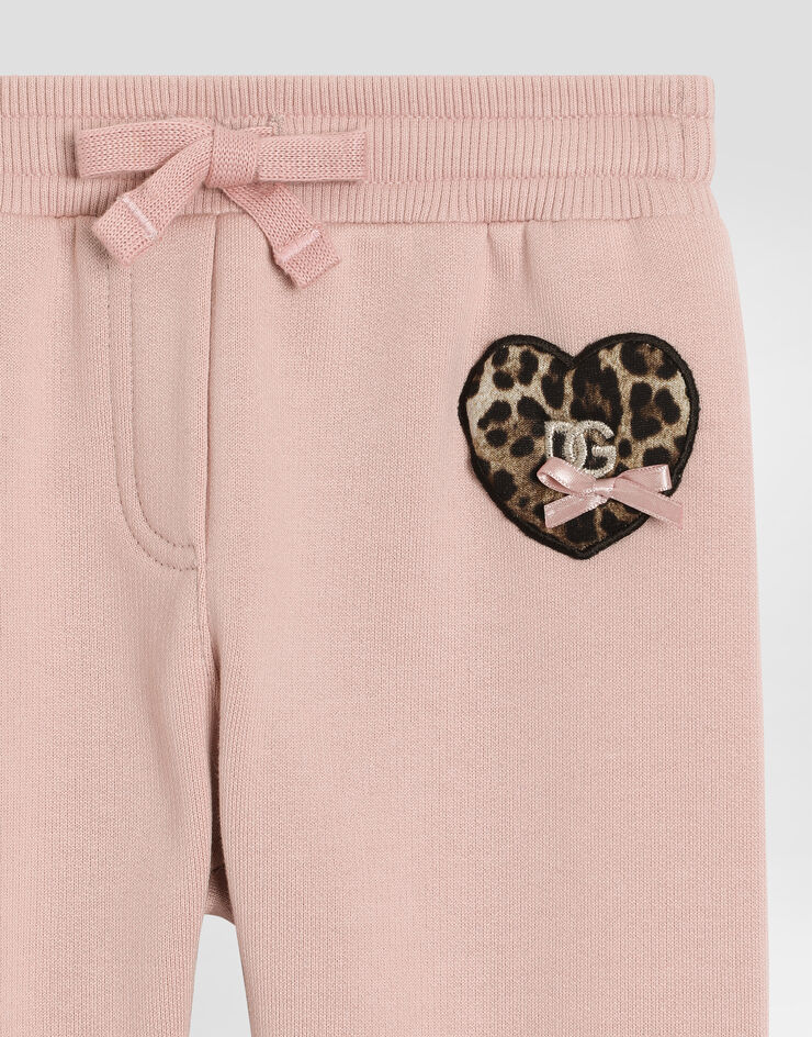 Dolce & Gabbana Fleece trousers with leopard heart patch Pink L2JPI1G7PSG