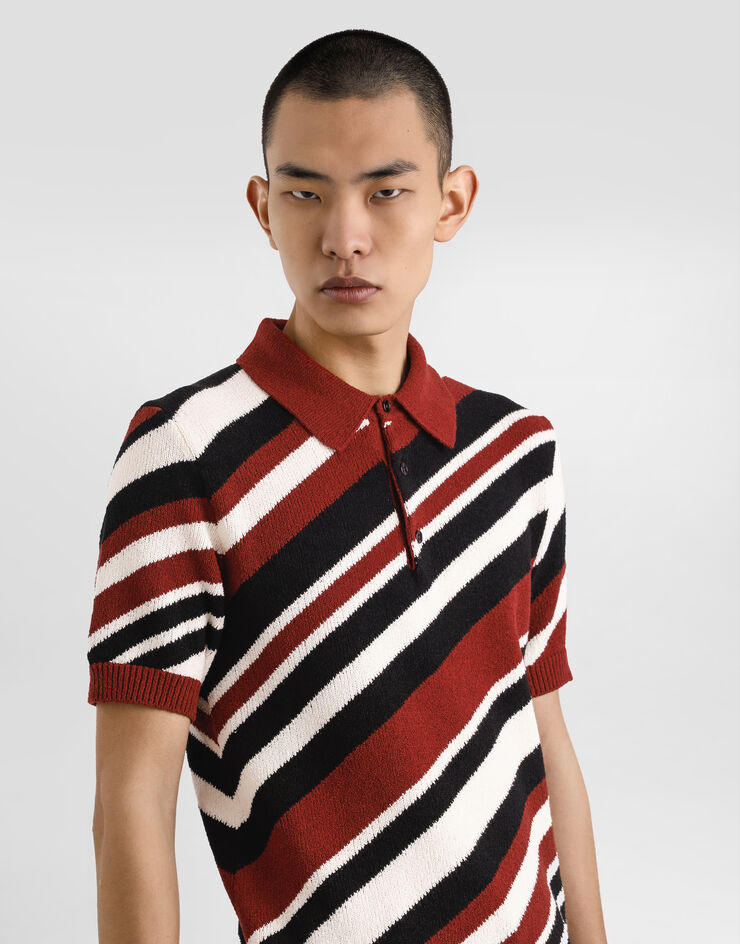Dolce & Gabbana Jersey polo de algodón de manga corta con intarsia a rayas Multicolor GXZ64TJFMMS