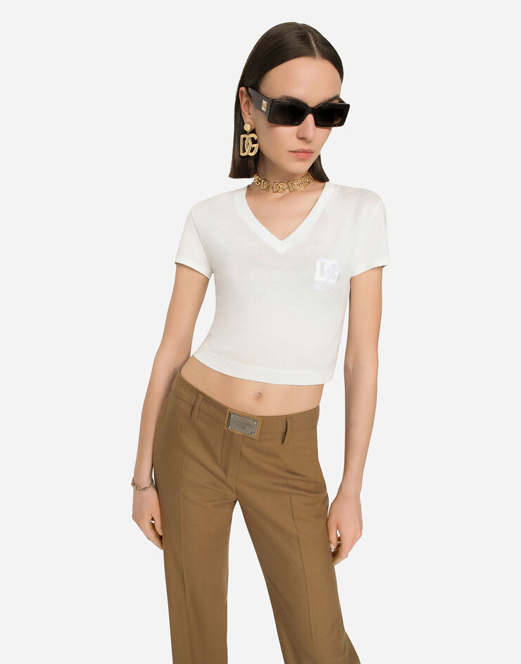 Dolce&Gabbana Flared flannel pants with logo tag Beige FTCZITGDBWW