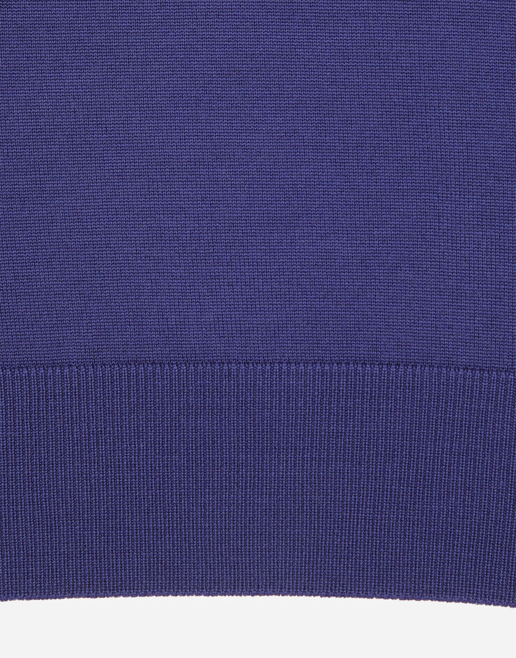 Dolce & Gabbana Poloshirt aus Wolle mit Logoplakette Blau GXO38TJCVC7