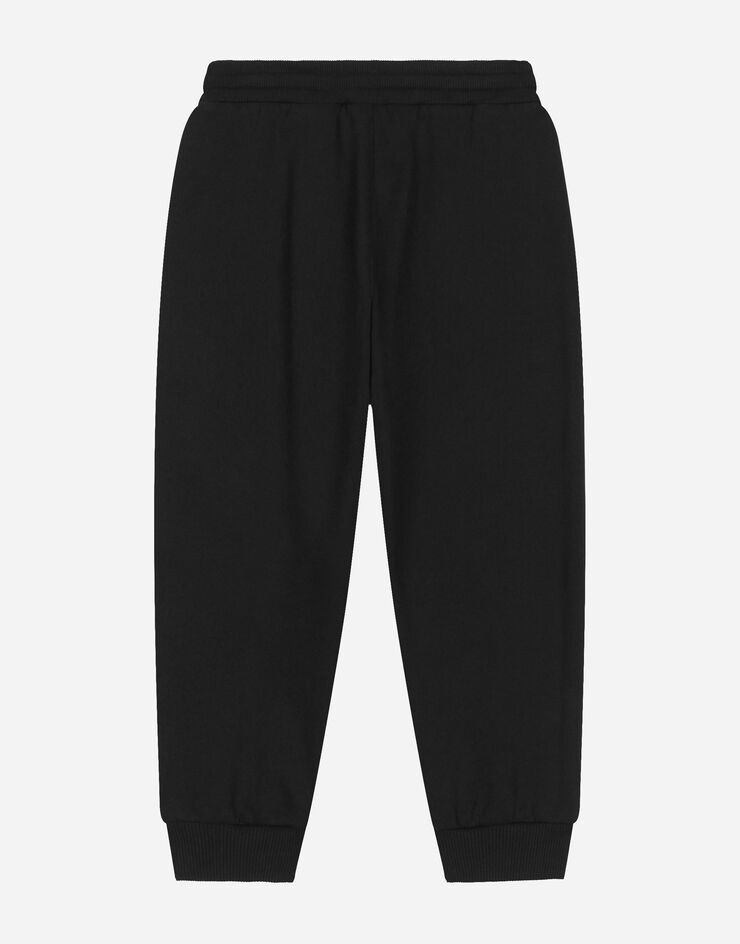 DolceGabbanaSpa Pantalon de jogging en jersey à imprimé floqué all-over Multicolore L4JPING7K2G