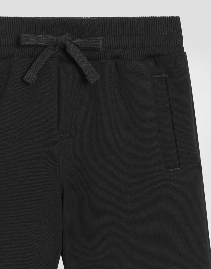 Dolce & Gabbana Bermudas de chándal en punto con placa con logotipo Negro L4JQD4G7I2P