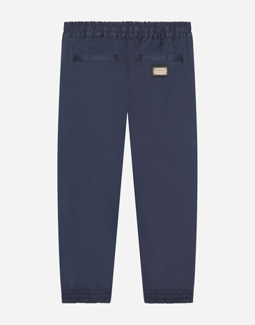 Dolce & Gabbana Stretch gabardine pants with logo tag Azul L44P32G7M4D