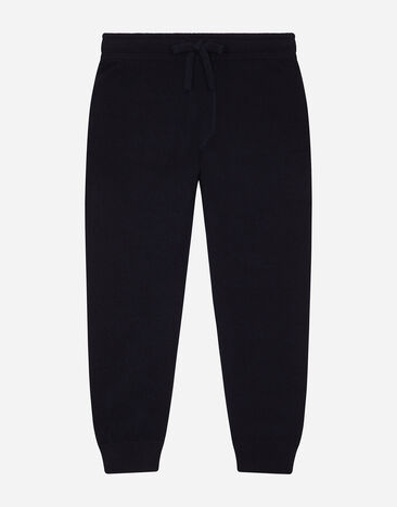 Dolce & Gabbana Plain knit jogging pants with logo tag Blue L44P16LDB17