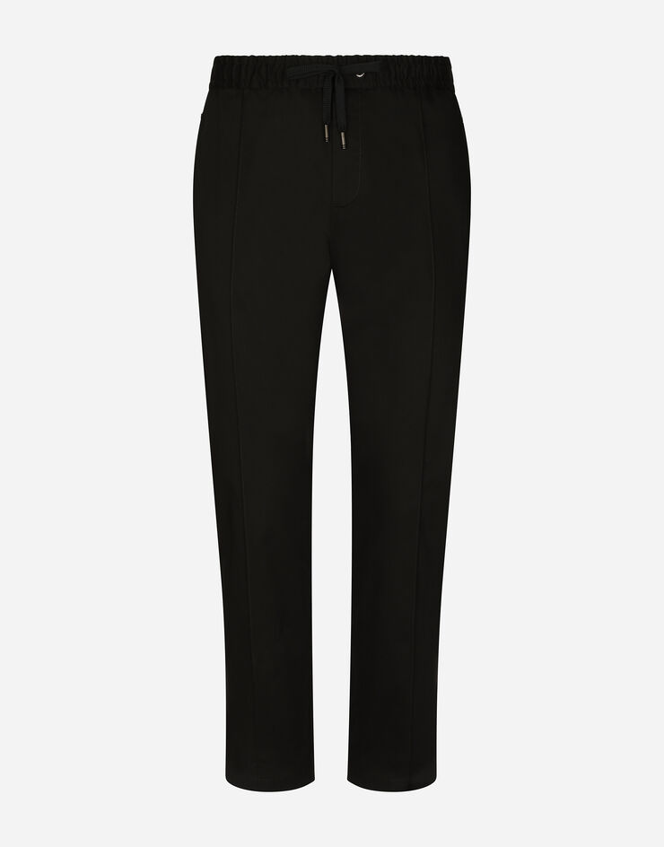 Dolce & Gabbana Pantalon de jogging en coton stretch avec plaquette Noir GYACETFUFIS