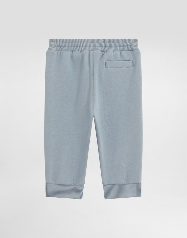 Dolce & Gabbana Oversized fleece trousers with leopard print and DG patch Blue L1JPIGG7PJD