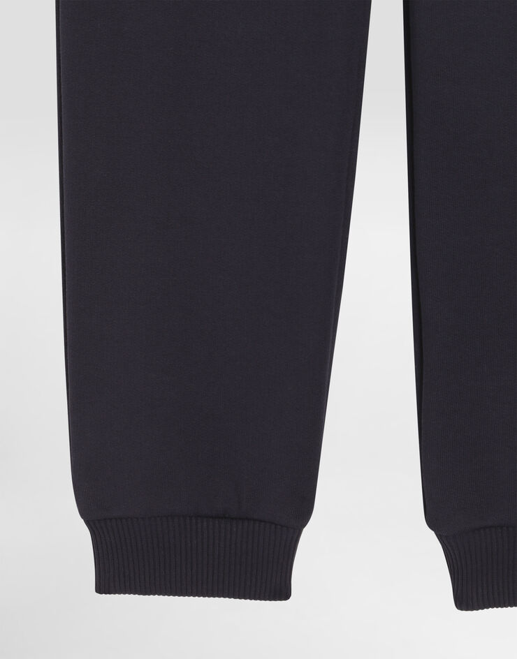 Dolce & Gabbana Fleece trousers with patch Blue L4JPIGG7PMH