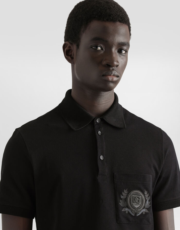 Dolce & Gabbana Poloshirt aus Baumwolle mit Stickerei Schwarz G8SN8ZG7O2I
