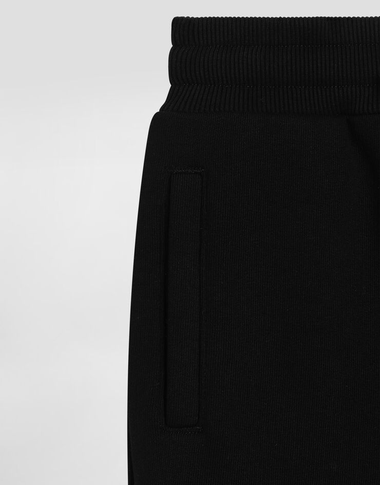 Dolce & Gabbana Oversized fleece trousers with DG logo and rhinestones Black L5JPH1G7PHM