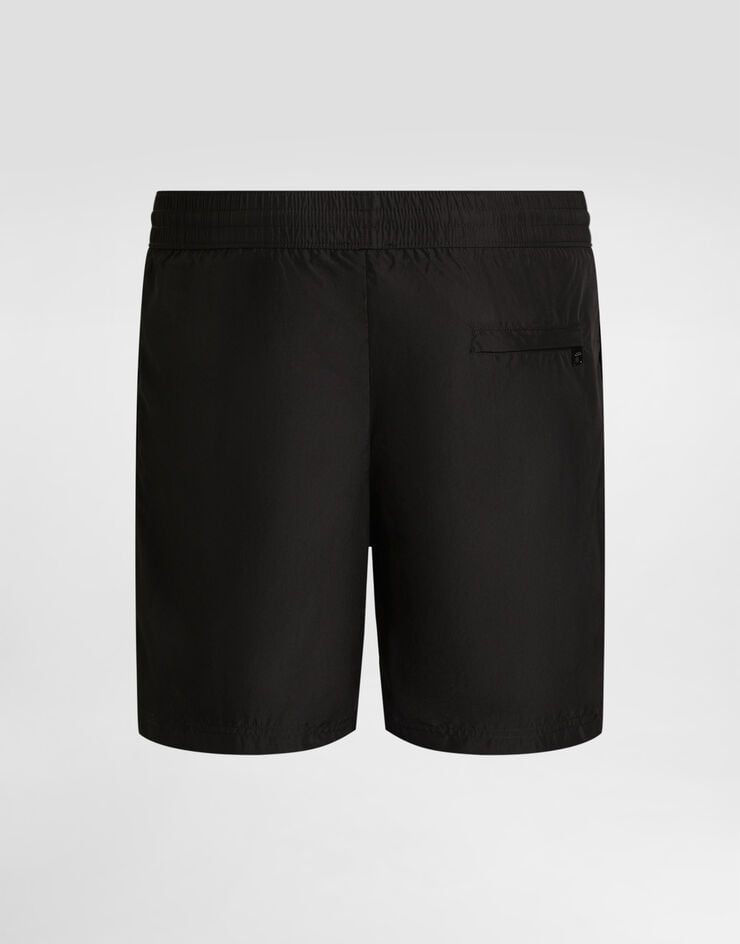 Dolce & Gabbana Mid-length swim trunks with logo tag Black M4E45TON0DK
