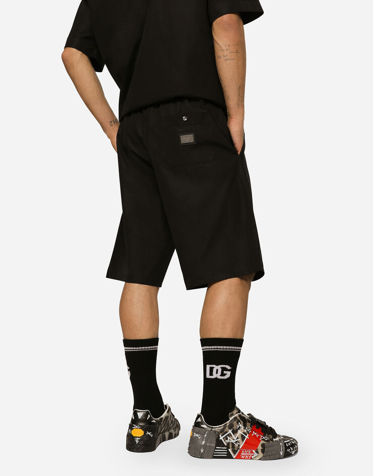 Dolce & Gabbana شورت للركض قطني ببطاقة شعار أسود GV37ATGF855