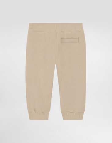 Dolce & Gabbana Fleece trousers with Dolce&Gabbana embroidery Beige L1JPKVG7PEQ