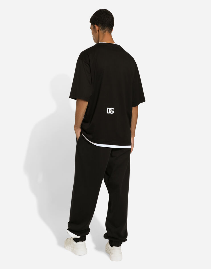 Dolce & Gabbana Pantalon de jogging en coton avec logo Noir GP03BTG7L3R
