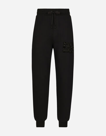 Dolce & Gabbana Pantalon de jogging avec écusson DG en strass Noir G9ZU0ZG7K4P
