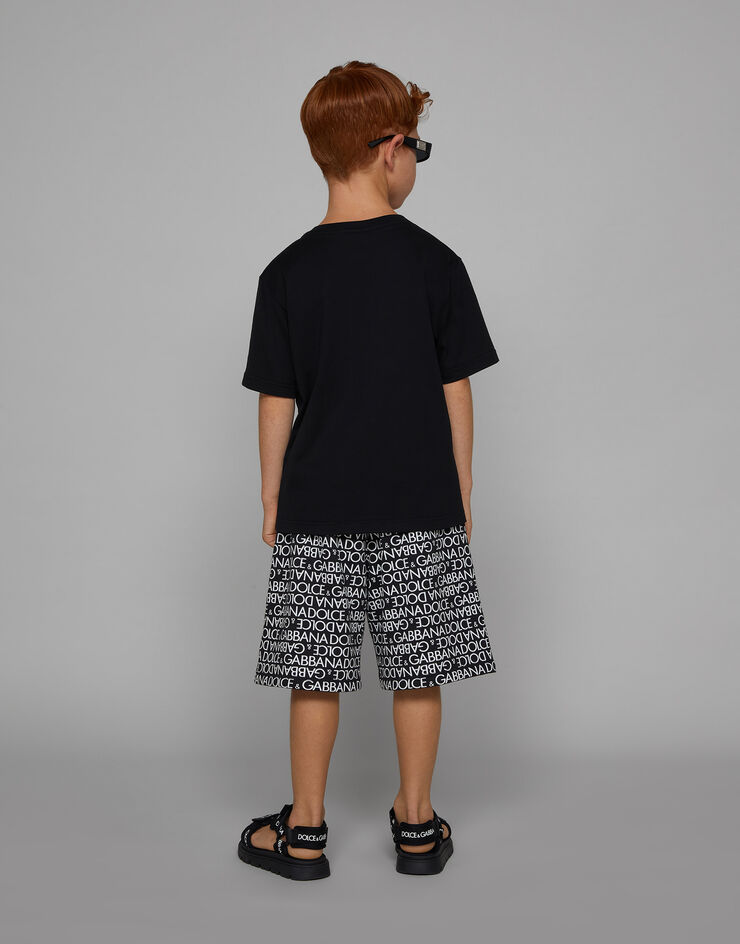 DolceGabbanaSpa Cotton jogging shorts with the all-over logo print Multicolor L4JQR1HS7MN