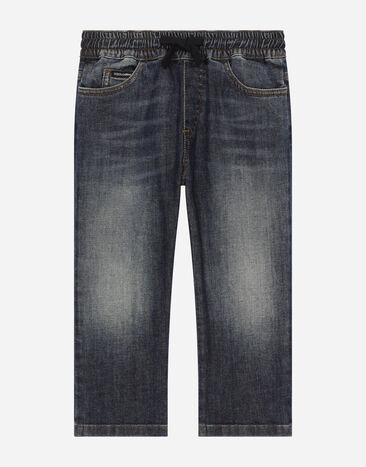 Dolce & Gabbana Jeans aus gewaschenem blauem Stretchdenim Drucken L4JQS3HS7NJ